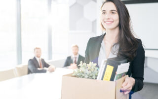 Waist up portrait of happy young businesswoman holding box of personal belongings leaving office after quiet quitting herjob, copy space