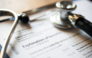 A clipboard that holds paperwork describing health benefits.