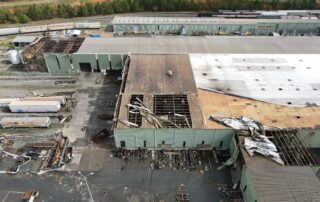 Commercial building damage after strong tornado storm.
