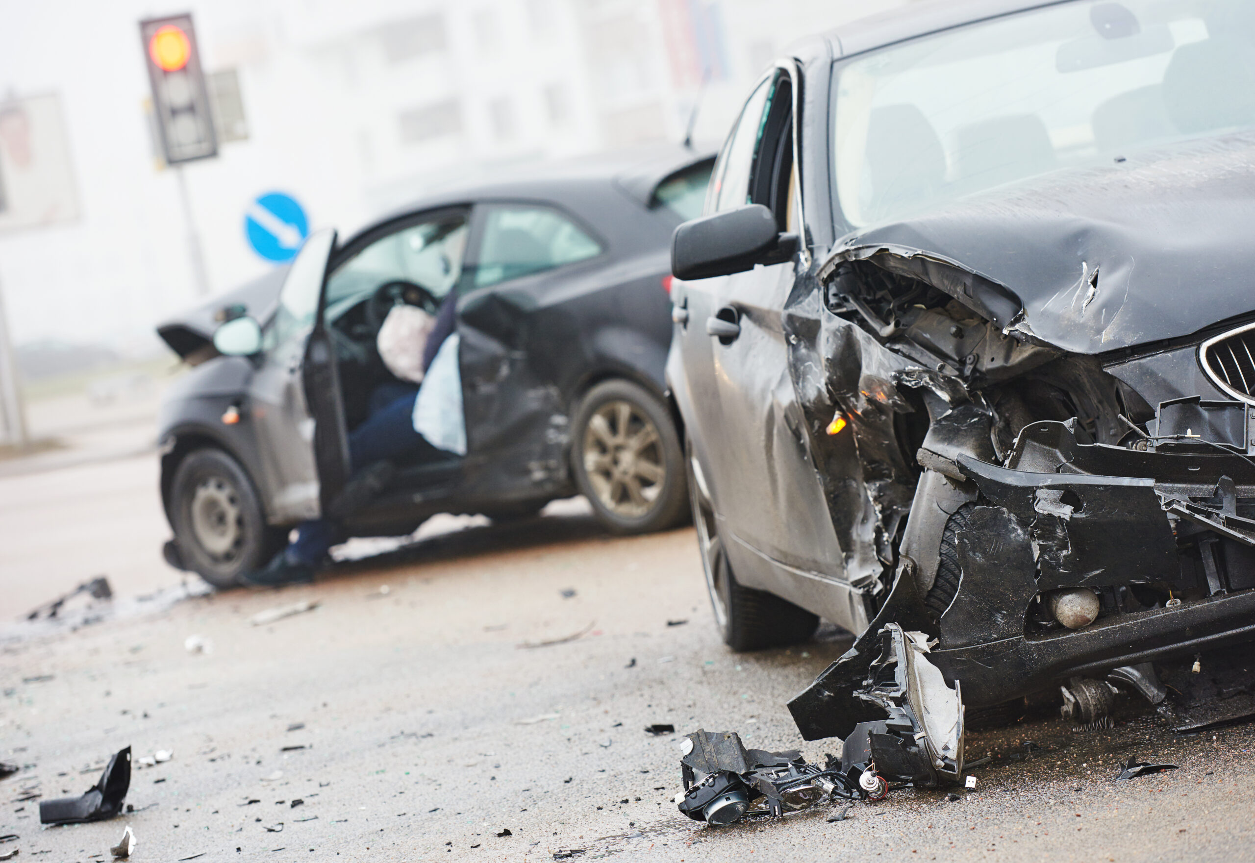 car crash accident on street, damaged automobiles after collision in city. Get protected with personal umbrella liability