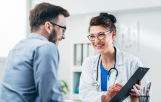 Doctor and patient sitting in doctor's office