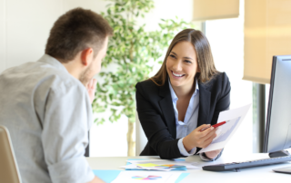2024 Open Enrollment Preparation: Boss showing a good job congratulating an employee at office