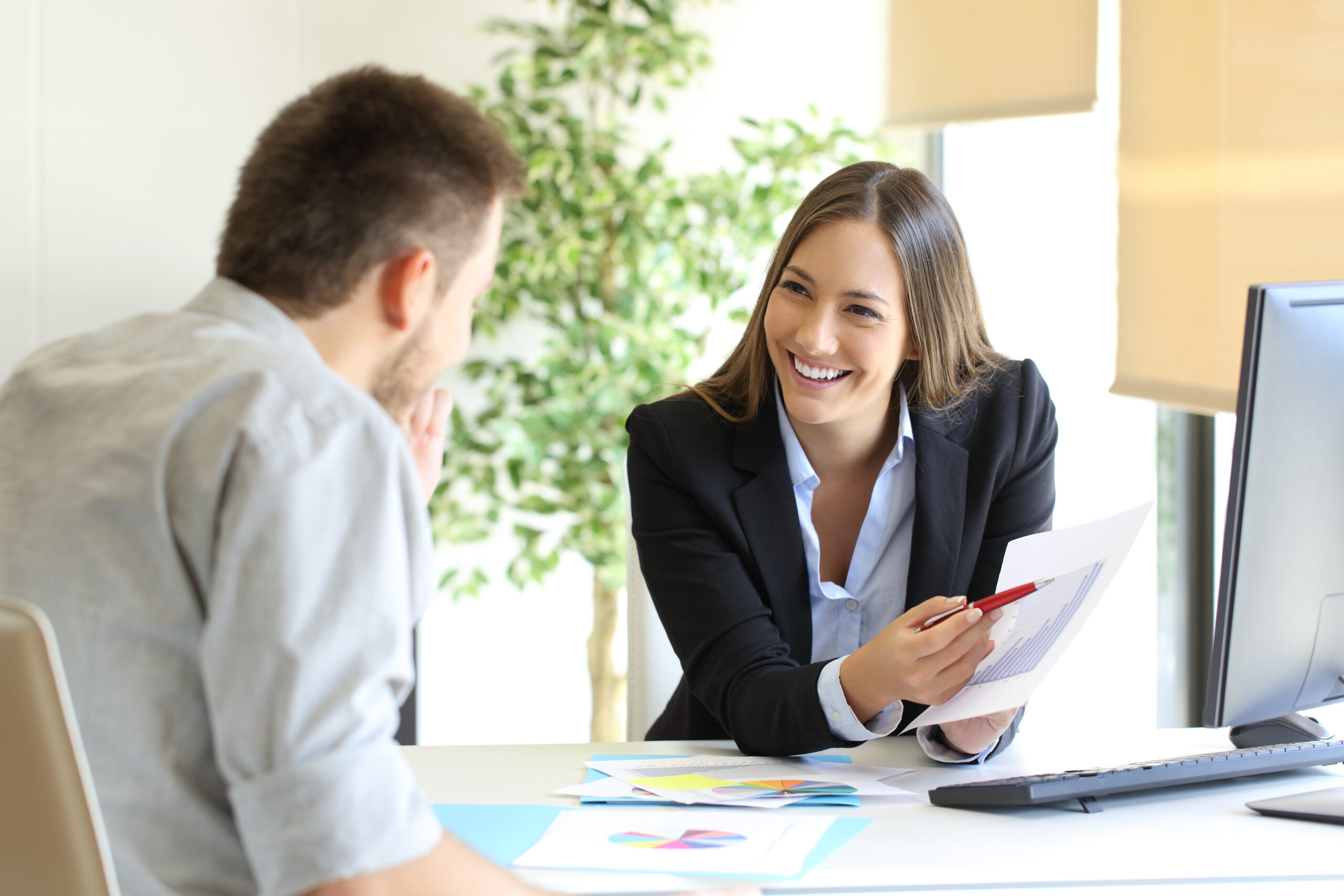 2024 Open Enrollment Preparation: Boss showing a good job congratulating an employee at office