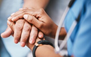 MPL insurance: Empathy, trust and nurse holding hands with patient for help