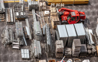 Construction Industry Trends to Watch: Aerial view of construction site with iron scuffolders