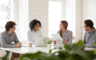 a group of colleagues reviewing their employee benefits packages.