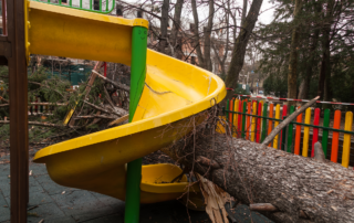 Catastrophic or “CAT” deductibles are the deductible amounts you pay in event of a loss caused by a catastrophic event, which can include named-storm wind, tornado, hail or flood. Pictured: A school playground damaged in a storm.