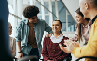 Six Healthcare Trends Employers Can't Afford to Ignore in 2024: A group of diverse colleagues sitting around discussing their mental health.