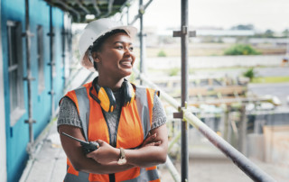 Personal Protective Equipment Considerations for Women in Construction: A female construction worker on a job site. PPE for women in construction is an important aspect of safety.