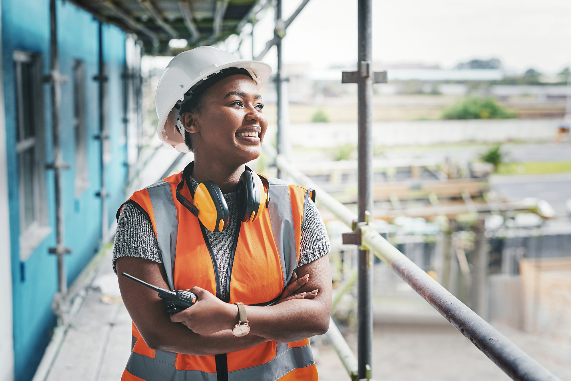 Personal Protective Equipment Considerations for Women in Construction: A female construction worker on a job site. PPE for women in construction is an important aspect of safety.