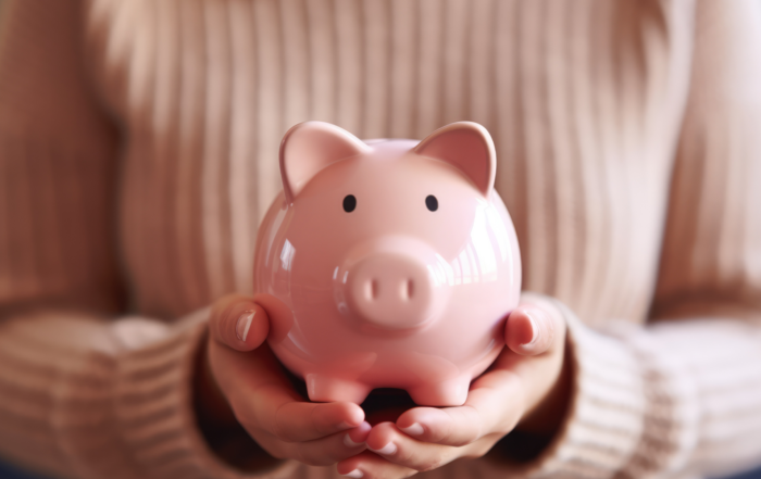 Inflation Drives 2025 HSA Contribution Limits Up Again: A female holding a piggy bank.