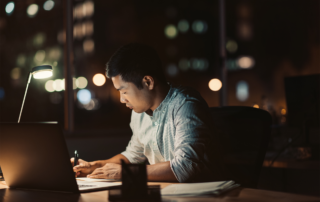 A man working overtime late at night.