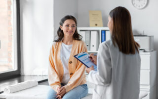 Open Enrollment 2025 – Health Savings Accounts (HSAs): A female patient meeting with her primary care physician.