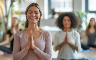 a group of females doing yoga and meditating. Wellness programs aim to improve employee health and well-being. But many miss the mark on inclusivity, potentially doing more harm than good.