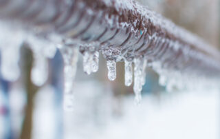 frozen pipes with icicles