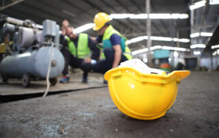 Accident at work of construction worker at site. Safety team helps employee accident.