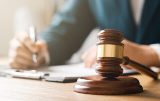 Justice concept, male judge doing report papers in courtroom, fair trial, drafting new law to modern era.