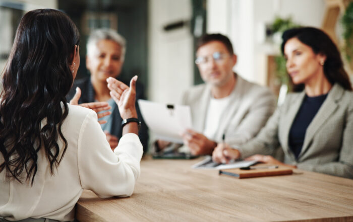Business, woman and meeting with discussion in office for risk assessment, strategy development and eco project. Environmental consultant, back and employees planning with policy advice or compliance.